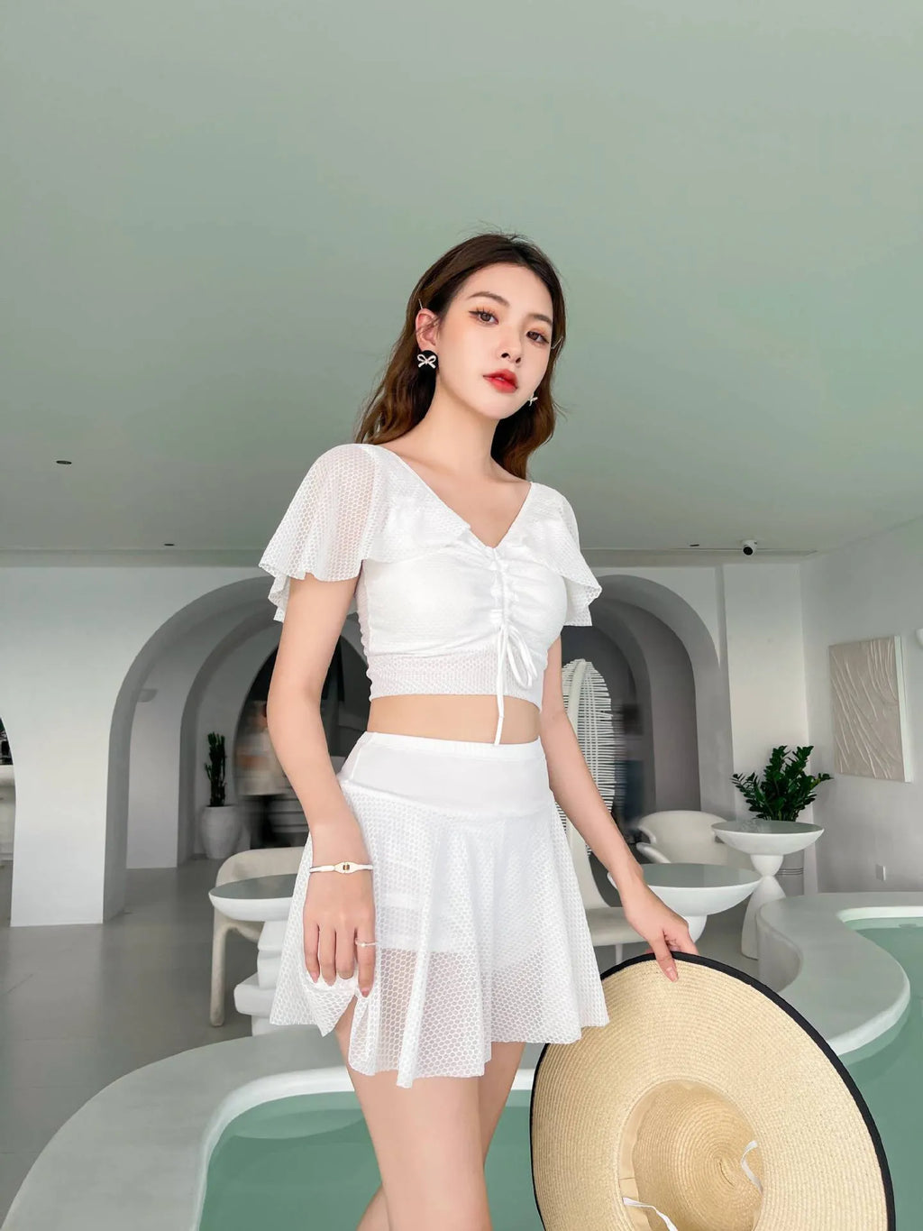 White women's two-piece skirt swimsuit set with top and skirt