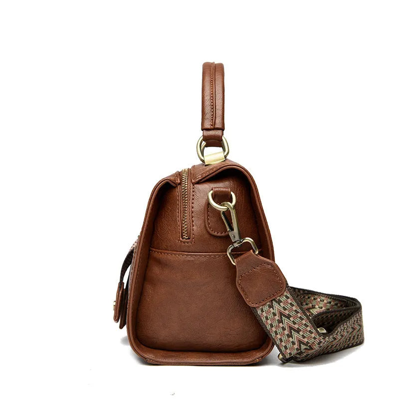 A soft PU leather women's one-shoulder crossbody bag in a horizontal square shape with retro styling.