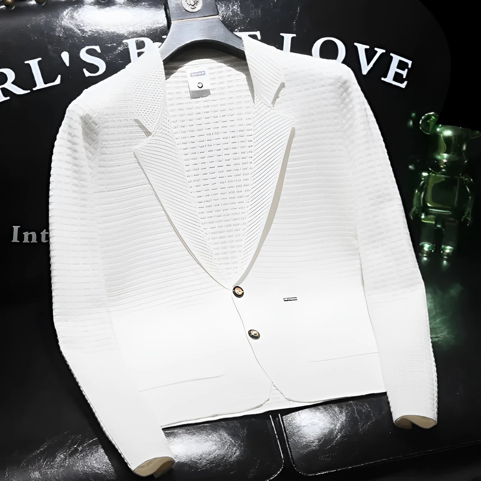 Men's white thin suit jacket with V-neck collar on a hanger