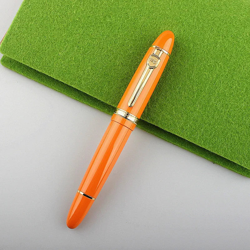 Metal ball pen with pearl round beads and black gold clip on white background