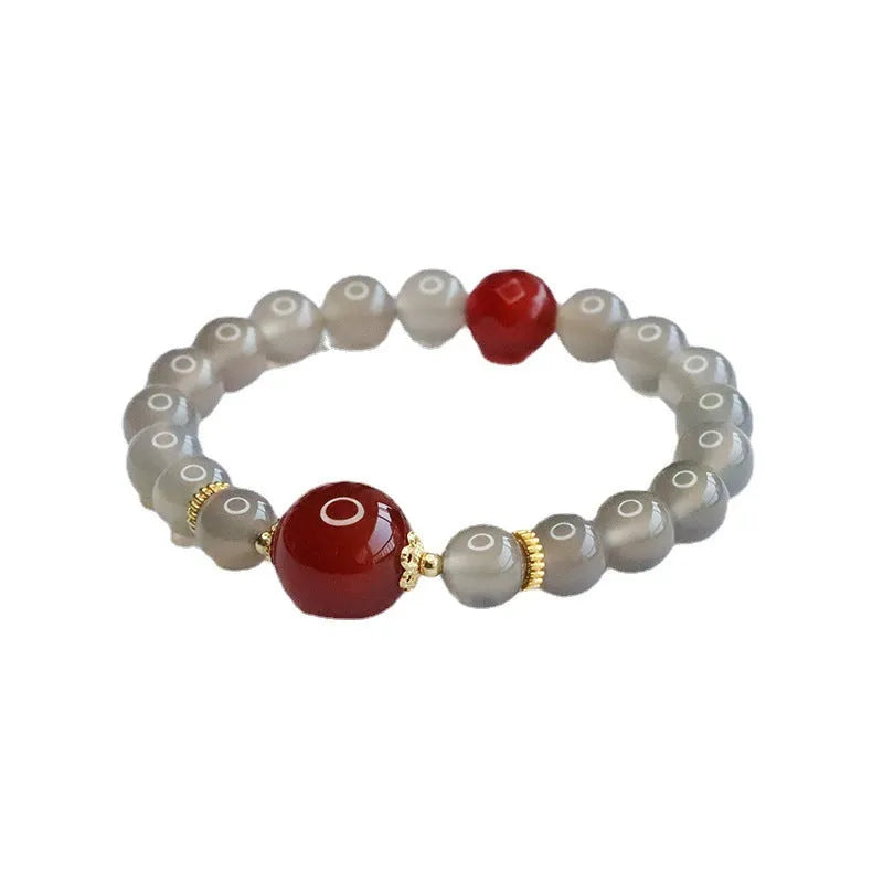 Women's smoky purple agate bracelet with 8mm geometric beads on a white background.