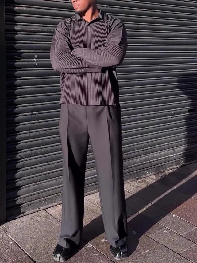 Black men's pleated long-sleeved casual top made from polyester fabric.