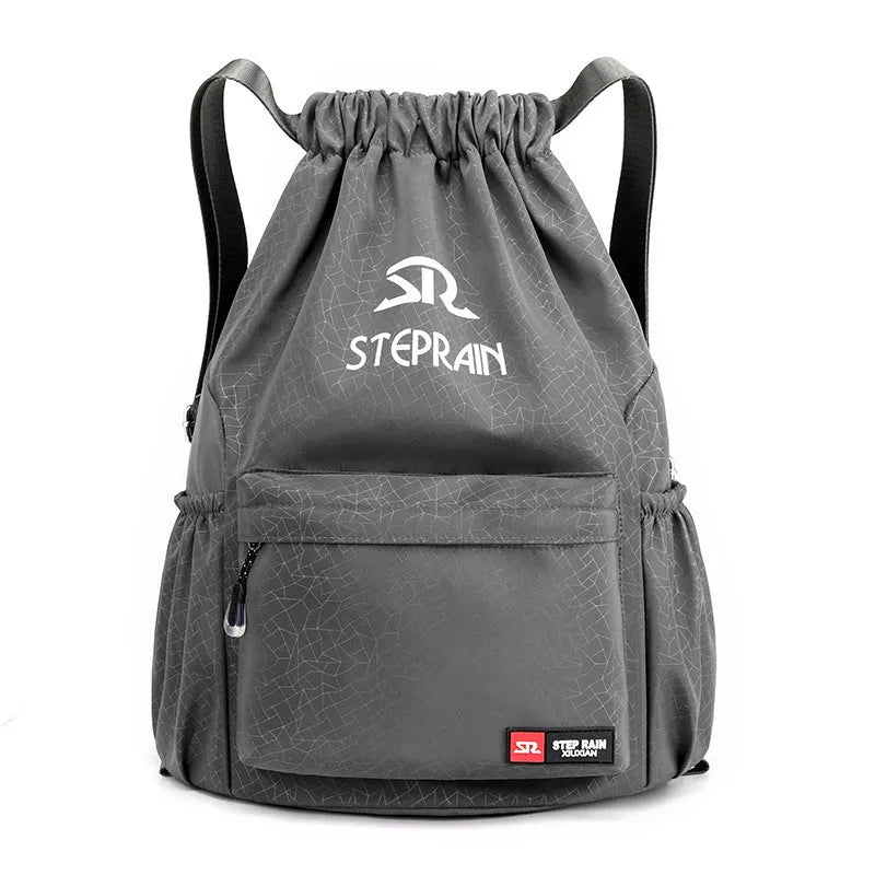 Lightweight solid colour Oxford cloth backpack with drawstring closure and double shoulder straps.