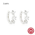 A pair of small round geometric stud earrings in sterling silver with a gold electroplated finish.