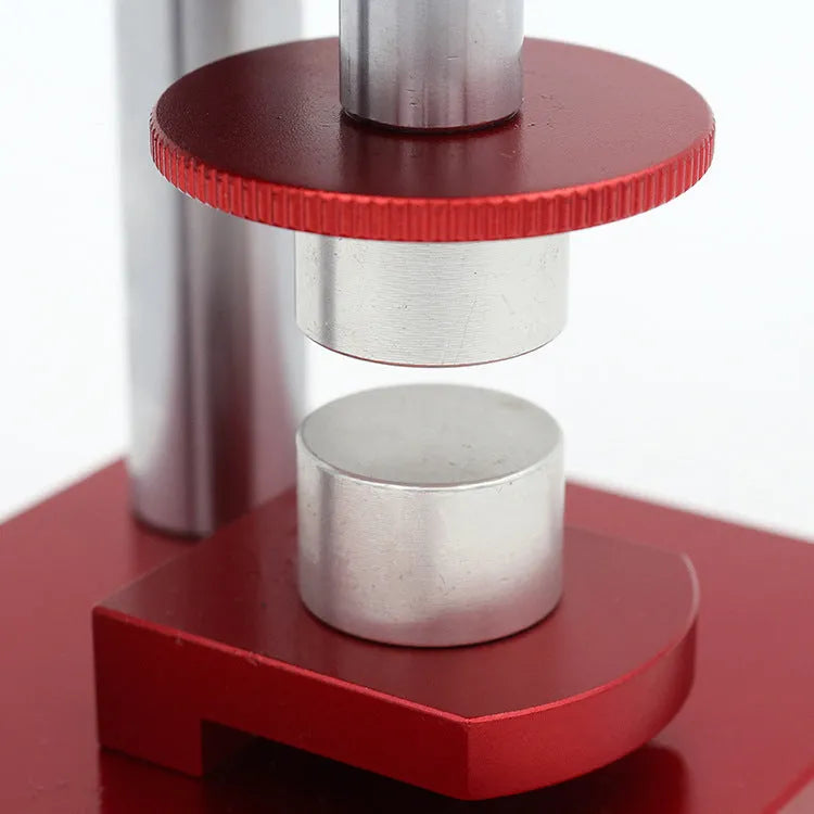 Spiral cap presser watch repair tool with a set of 20 plastic moulds for watch back covers.