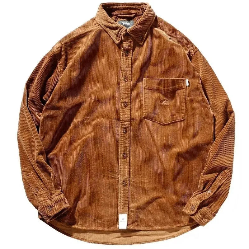 Loose fit caramel corduroy long sleeve shirt with a cardigan style on a hanger.