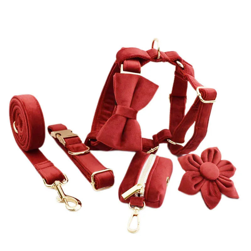 Coordinated dog collar and leash set with matching bow tie, vest, and decorative flower accessory
