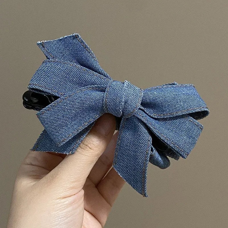 Blue denim bow barrette with cloth bow and metal clip on women back head hair