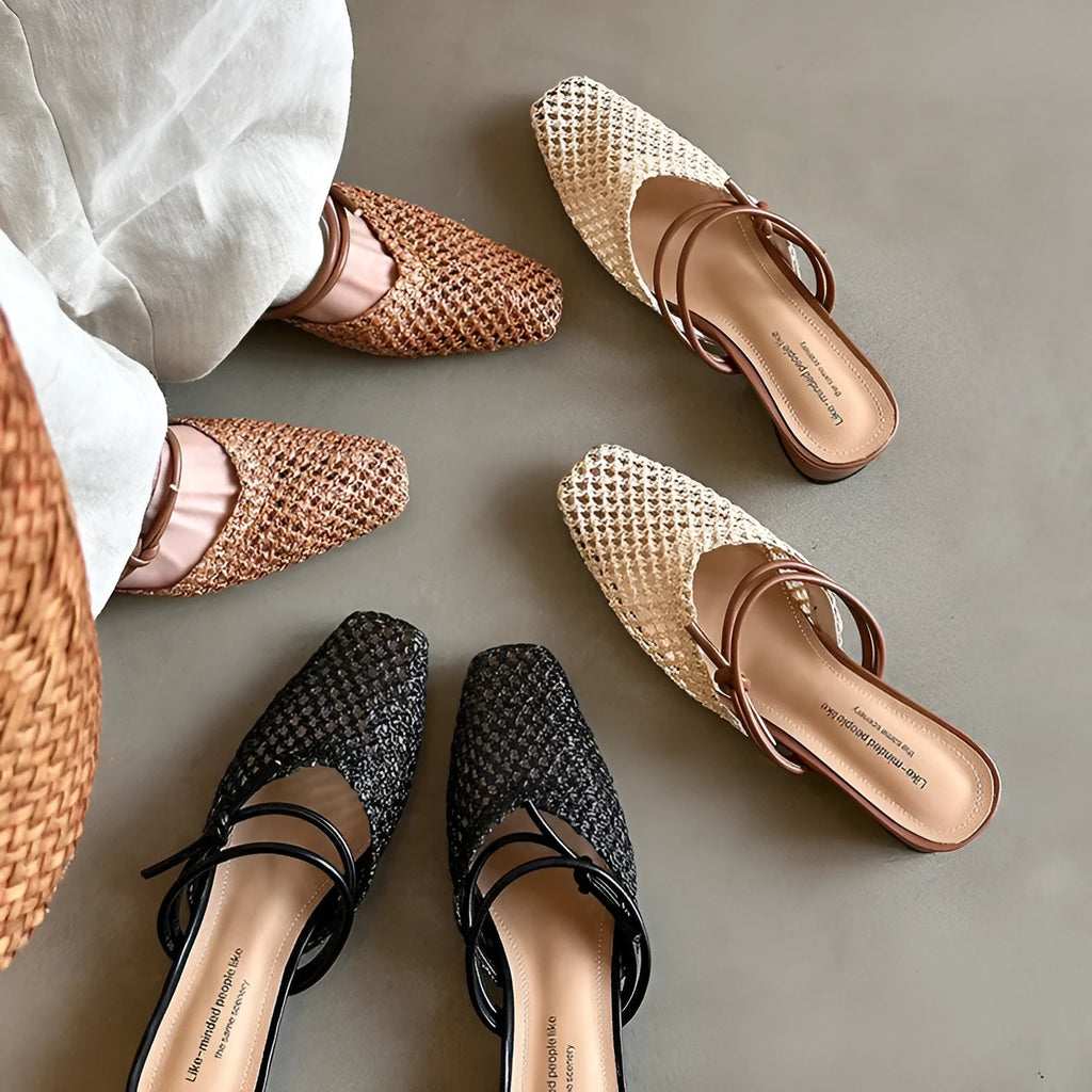 Women's beige square toe slippers with hollow-out design and a chunky mid-heel on a rubber sole.