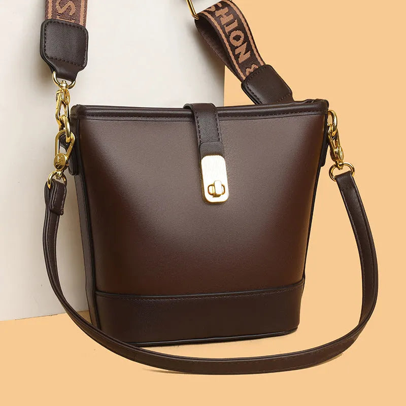 Korean style black PU bucket messenger bag with dual shoulder straps and internal organiser compartments