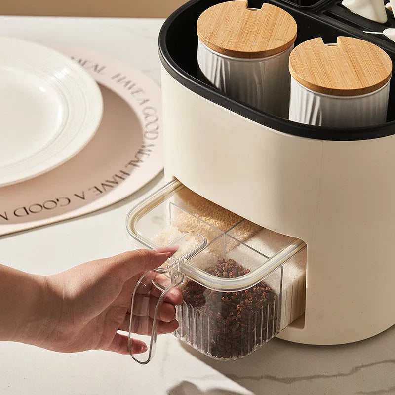 White rotating kitchen storage bucket with four compartments for cutlery and a separate spice box organiser.