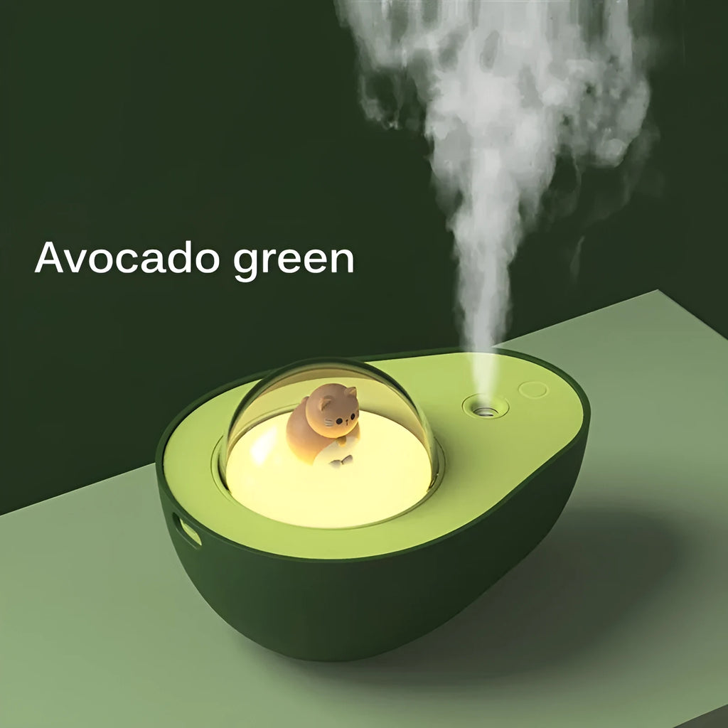 Green avocado-shaped mini humidifier with USB cable and night light on a desk