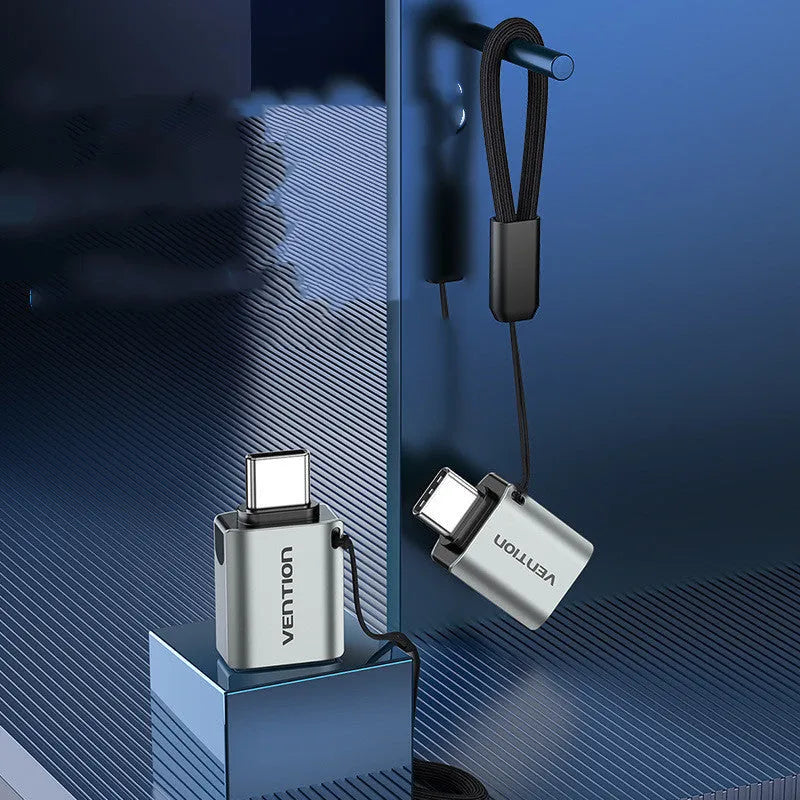 Grey aluminium USB 3.0 Type-C male to Type-A female OTG adapter with attached lanyard
