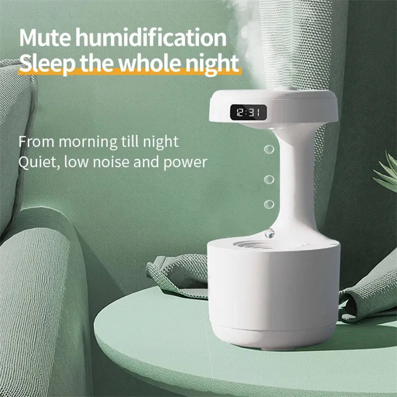 White columnar anti-gravity humidifier with LED clock display and mist output on a wooden desk.