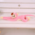 Long arm plush monkey toy hanging over a curtain pole in dark brown colour.