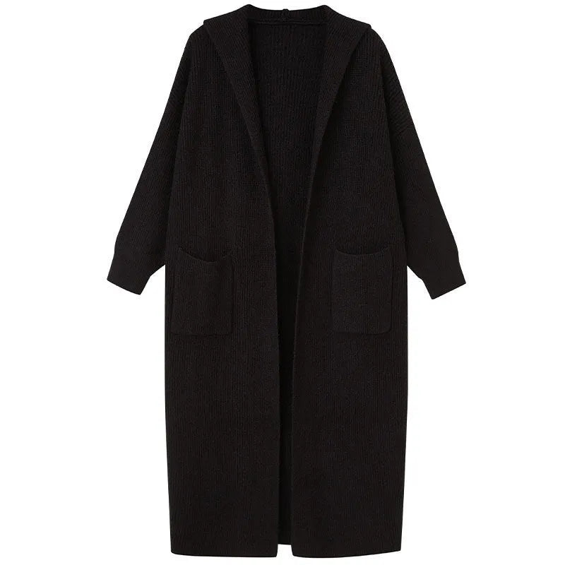 Long grey knitted women's cardigan with hood and trench coat design, shown open as a front-fastening garment.