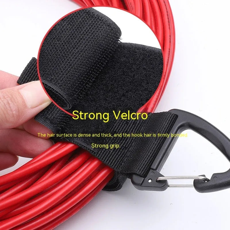 Black adjustable heavy-duty storage strap with gravity climbing button and silver D-ring carabiner hook.