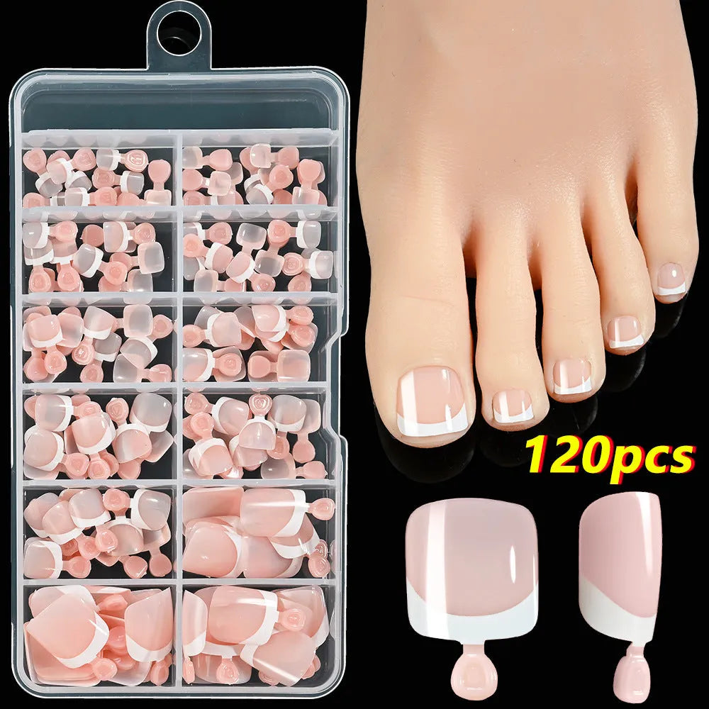 120 piece boxed set of full square short artificial toenails with French white edge design on nude base