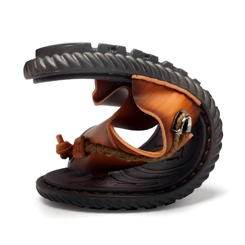 Men's dark blue herringbone pattern outdoor slippers with a rubber sole and leather lining.