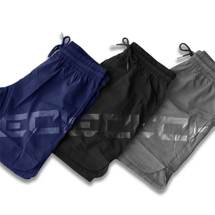 Men's black elastic training running shorts with knee-length cut and quick-dry fabric