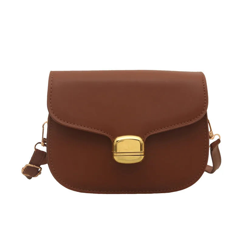 Simple PU handbag for women in one of six colours, showing interior with zippered change purse and phone pocket.