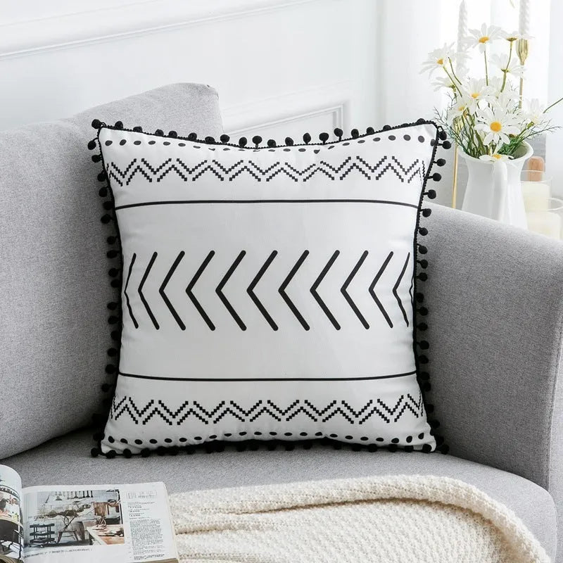 Bohemian national style polyester cushion cover in light grey on a sofa.