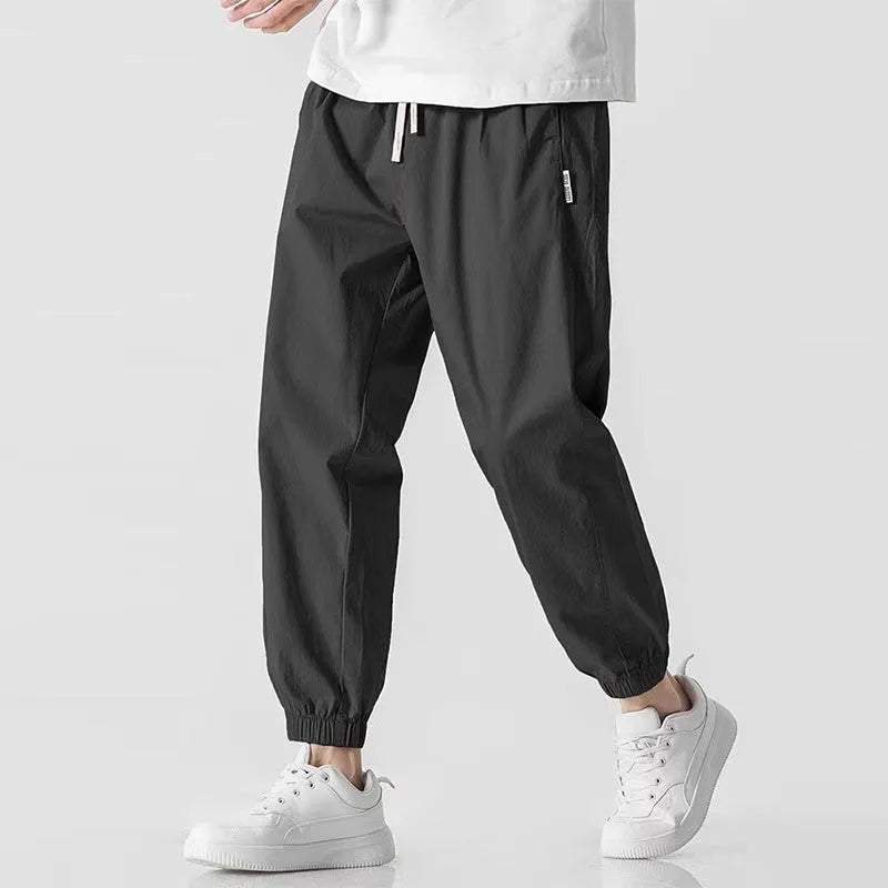 Men's fashion loose cuffed cargo pants in khaki, polyester fabric, autumn casual trousers with cuffed hem