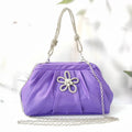Women's soft polyester messenger bag in lavender purple with a chain strap and shell shape.