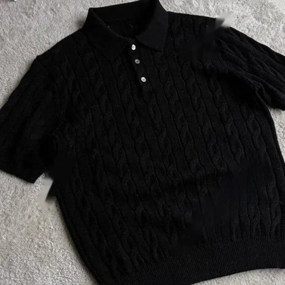 Man wearing a grey knitted short-sleeve T-shirt made from twisted combed cotton blend.