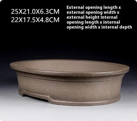Handmade antique oval bonsai flower pot in purple sand ceramic, 25cm long by 21cm wide.