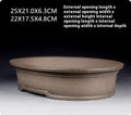 Handmade antique oval bonsai flower pot in purple sand ceramic, 25cm long by 21cm wide.