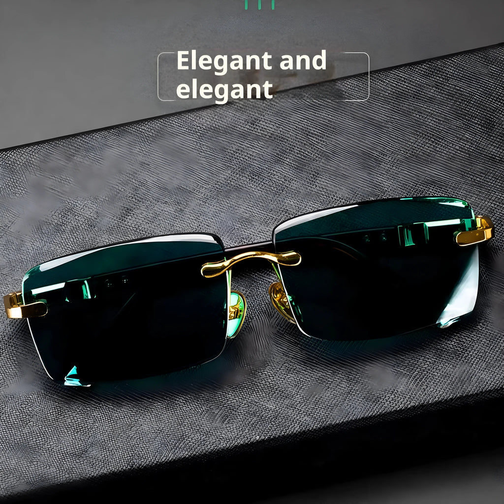 Frameless dark green crystal sunglasses with minimalist design on a case with cleaning cloth.