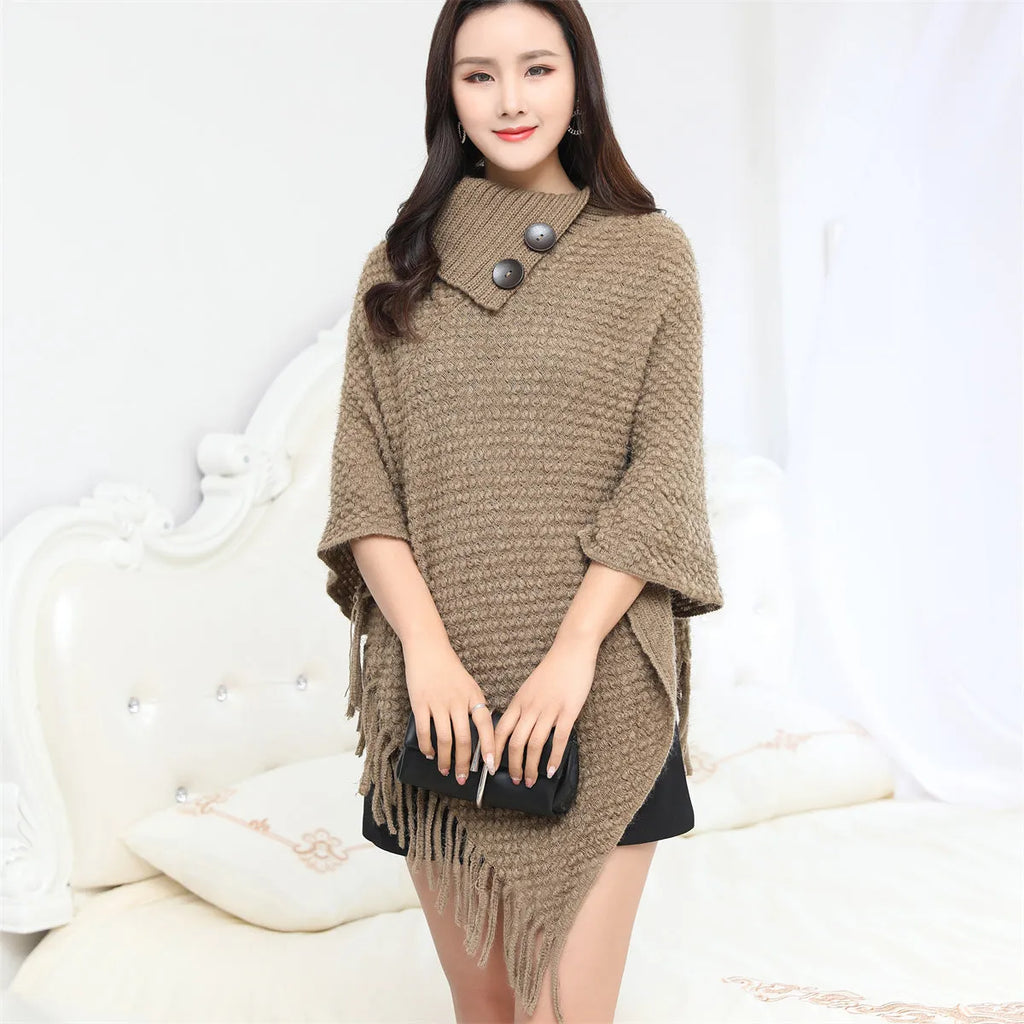 Women's dotted pattern sleeveless knit cloak shawl in acrylic fibre, shown in apricot colour.