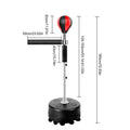 Black small boxing ball reaction trainer with 360° flexible reflex bar and 8 suction cup base on a tiled floor