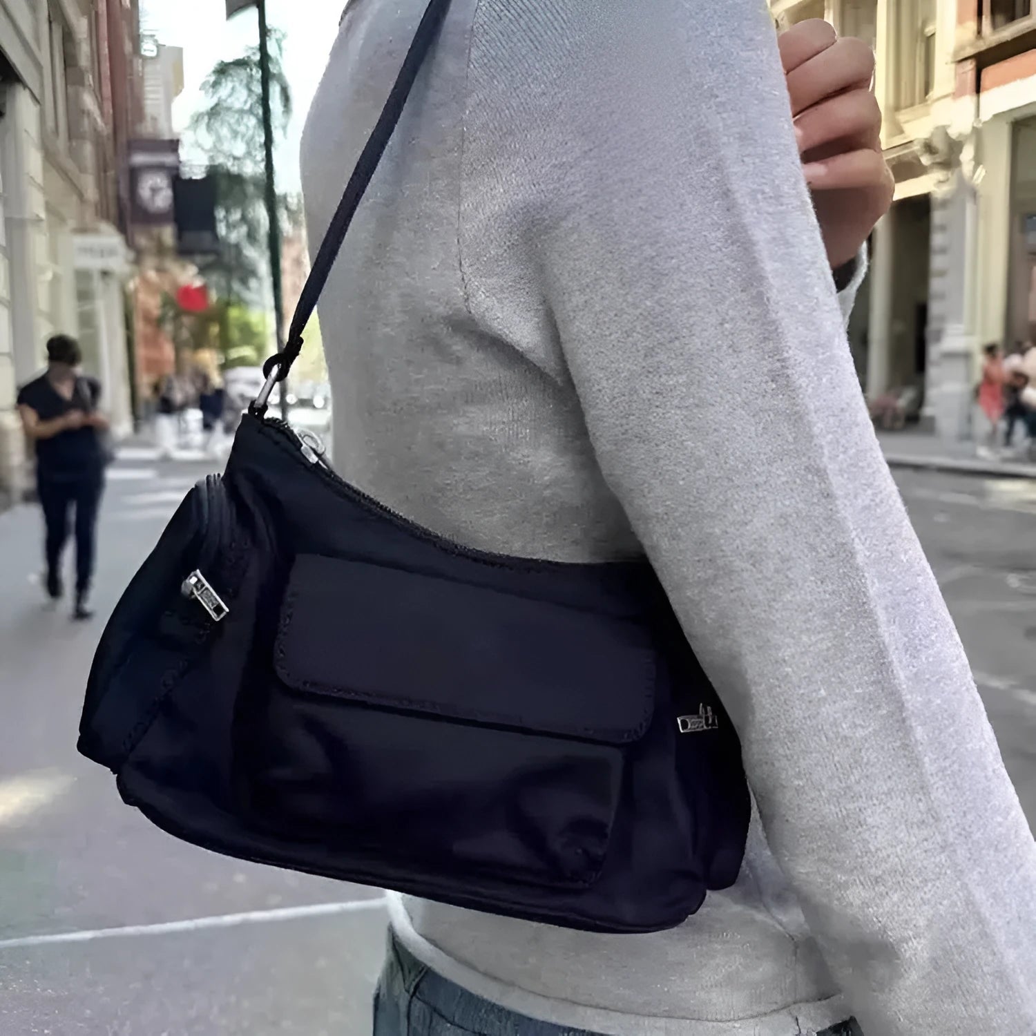 Black PU nylon women's shoulder bag with two pockets and side line detail showing dimensions