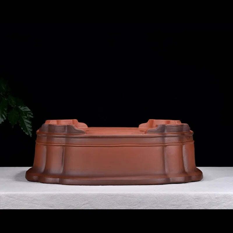 Large antique finish purple clay rectangular flowerpot with carved Chinese tree stump, pine, cypress, and fruit designs.