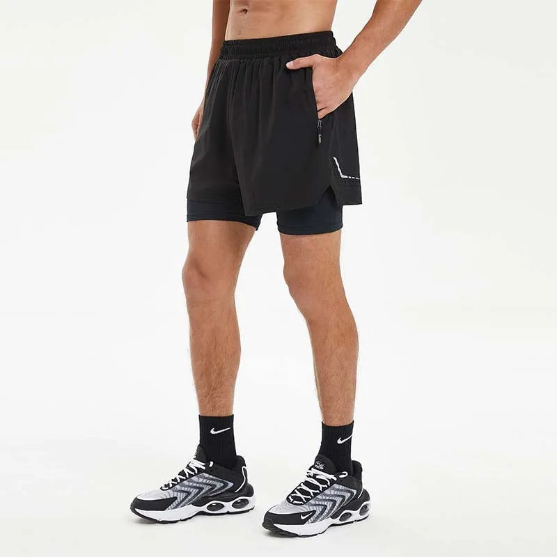 Men's black double-layer running shorts with an inner liner, shown on a size chart.