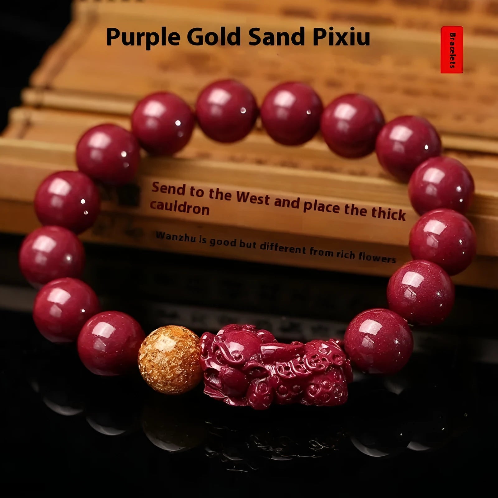 Polished purple and gold sandstone cinnabar bracelet with totem design on a wrist.