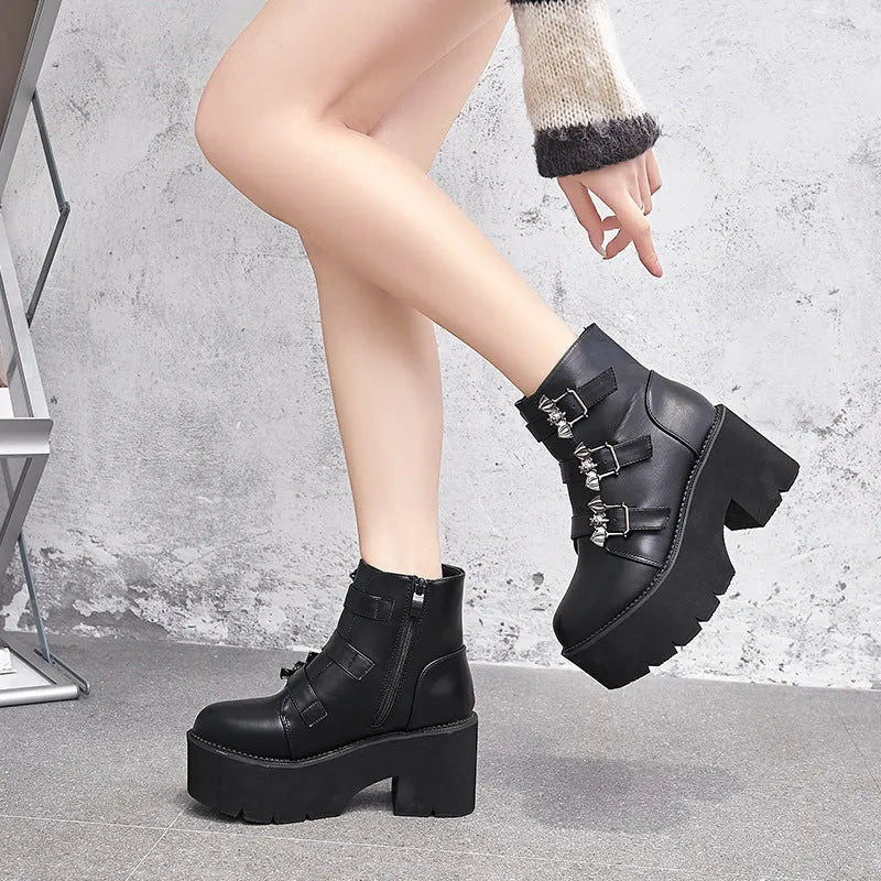 Black women's punk platform ankle boots with bat buckle and side zip.