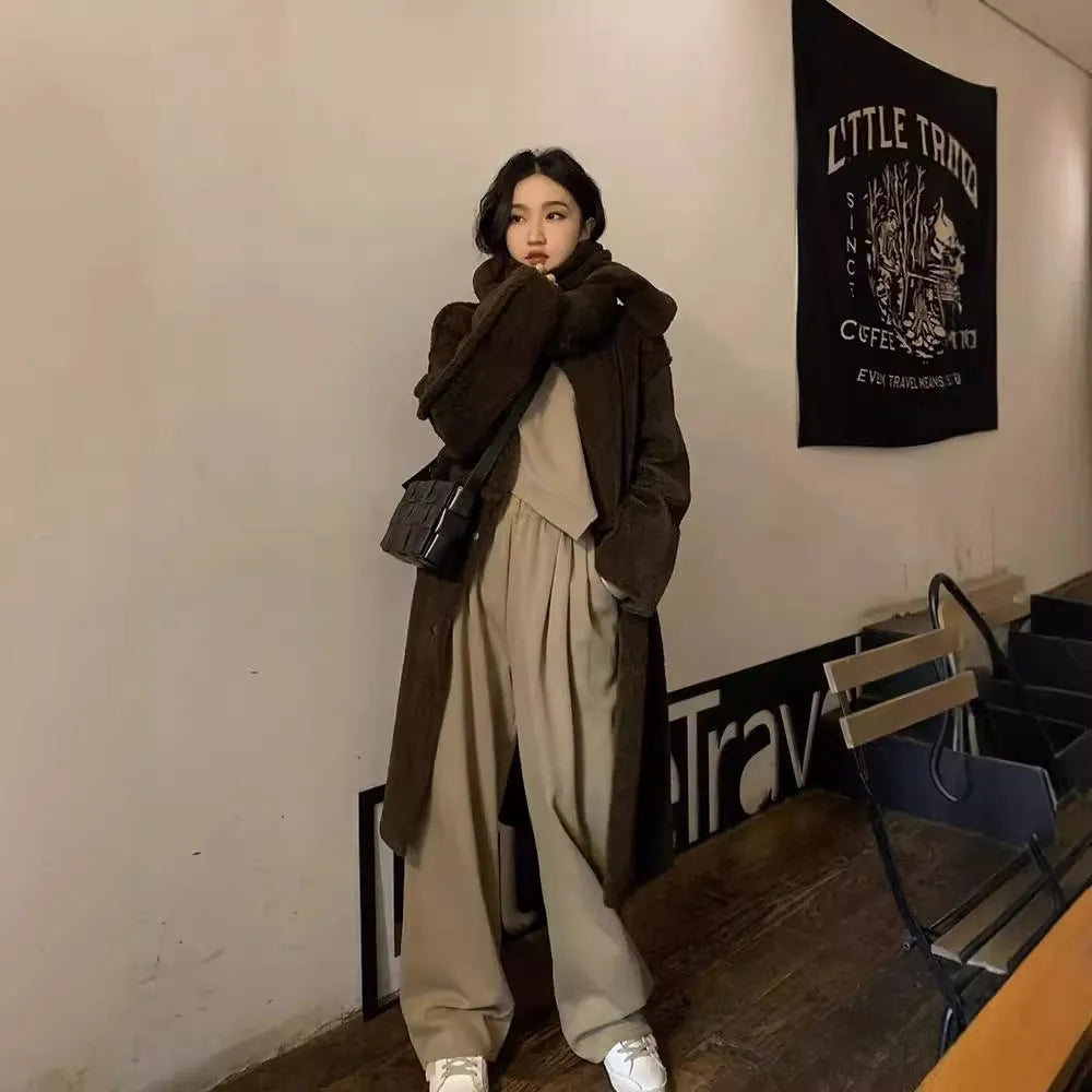 Women's khaki loose-fit polyester casual sports suit set with long sleeves and trousers.