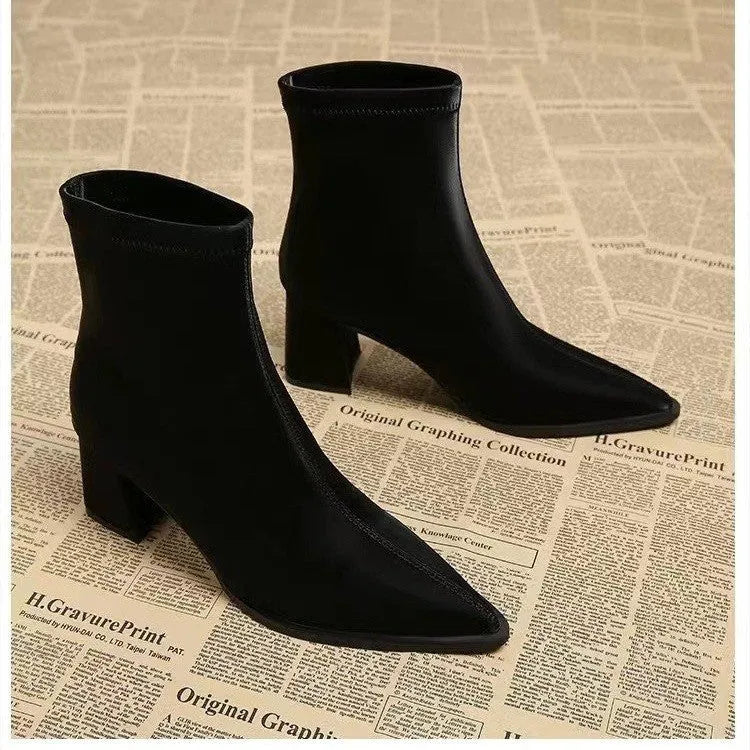 Women's khaki pointed toe ankle boots with a wedge heel on a white background.