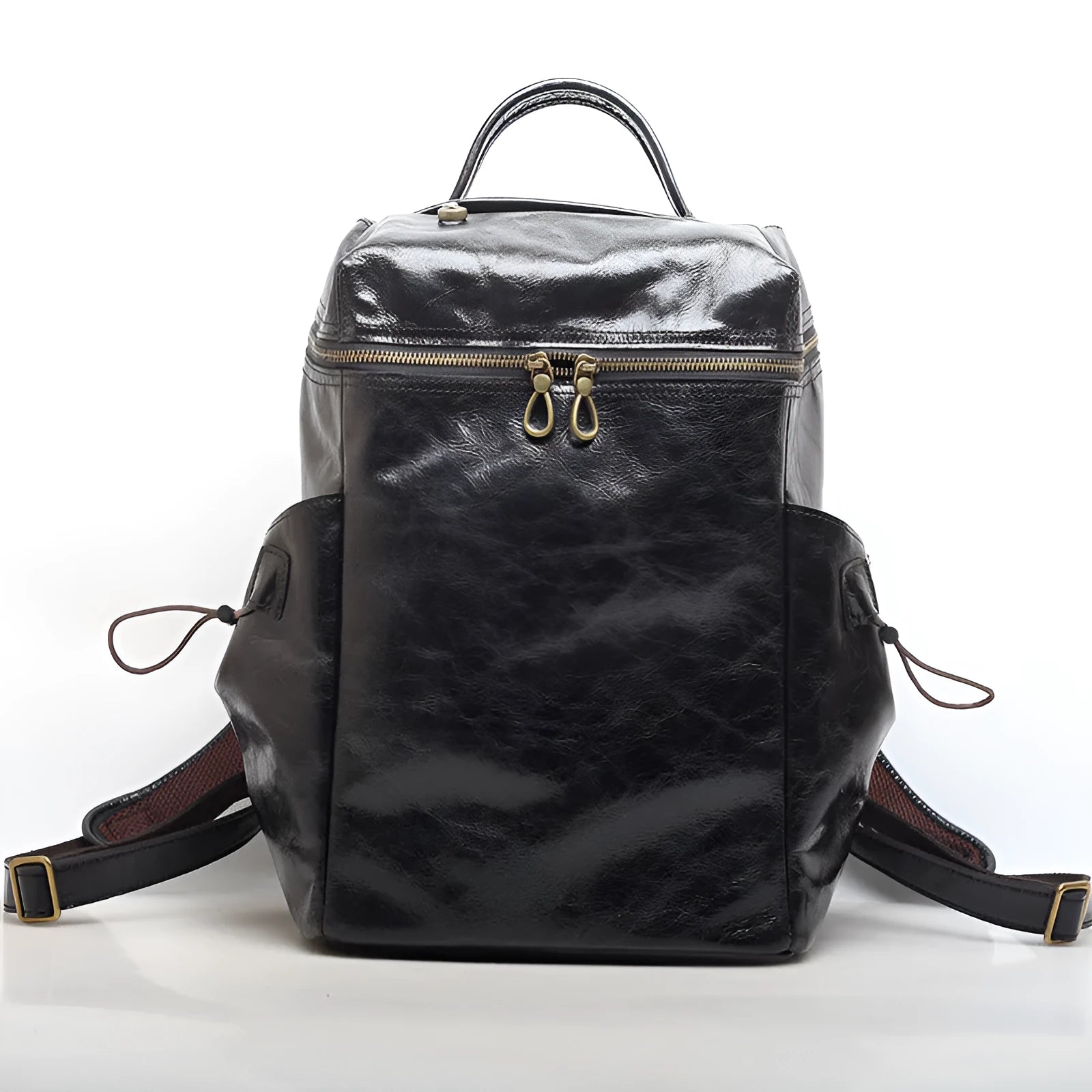 Classic retro backpack in brown Crazy Horse leather with exposed stitching and metal buckles