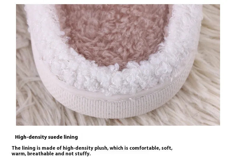 White fluffy slippers with cartoon pattern, rubber soles, and artificial wool lining