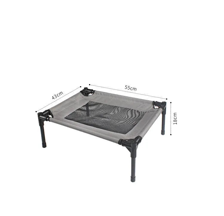 Black portable outdoor dog bed with removable washable cover and steel frame, shown on grass.
