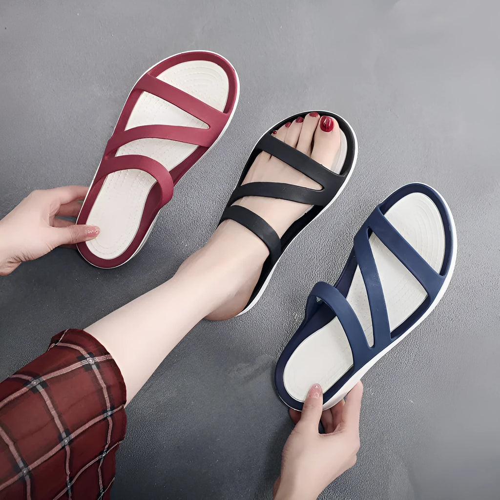 Women's casual sandals in red, made from breathable PP material, shown from the side.