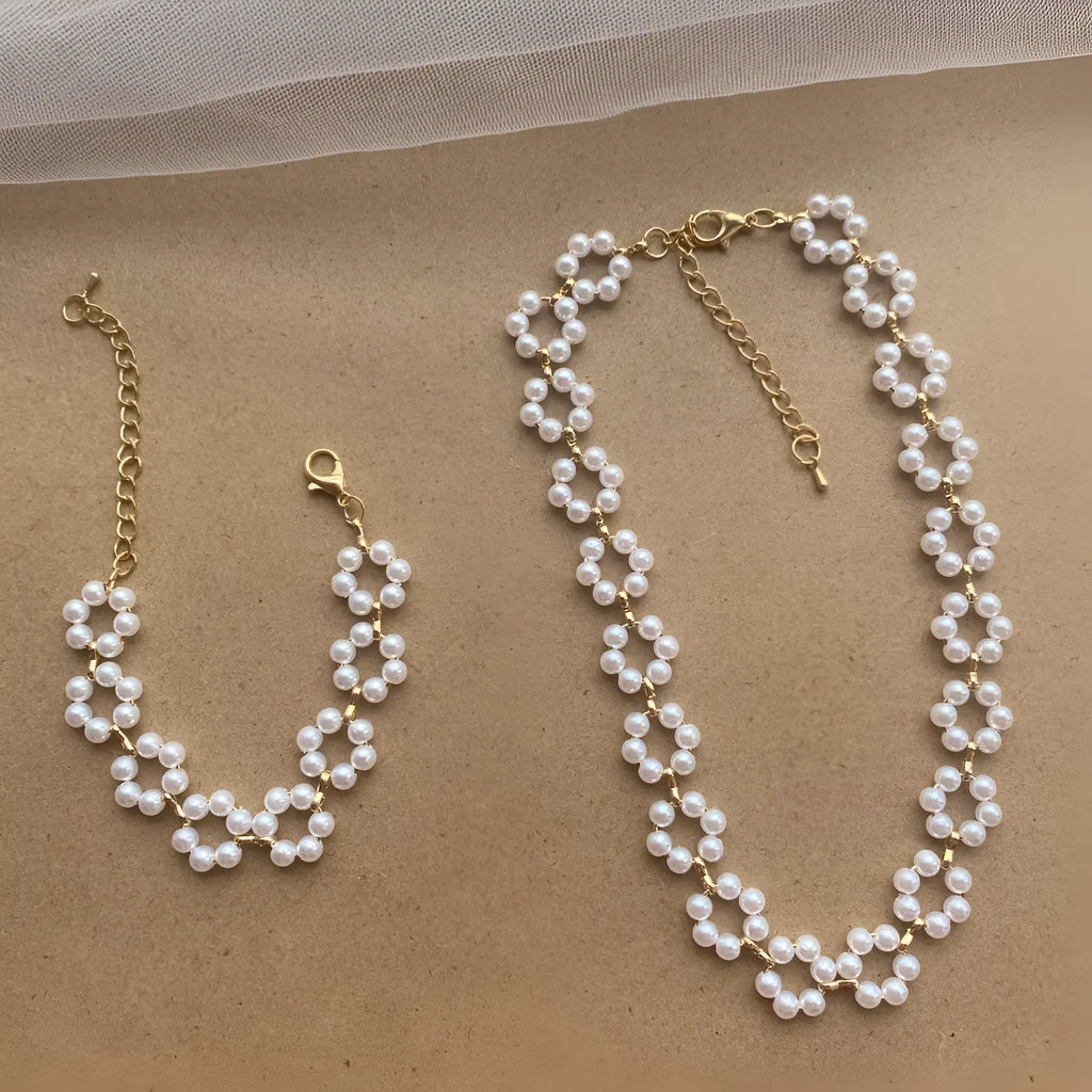 Pearl necklace and bracelet set for women on white background