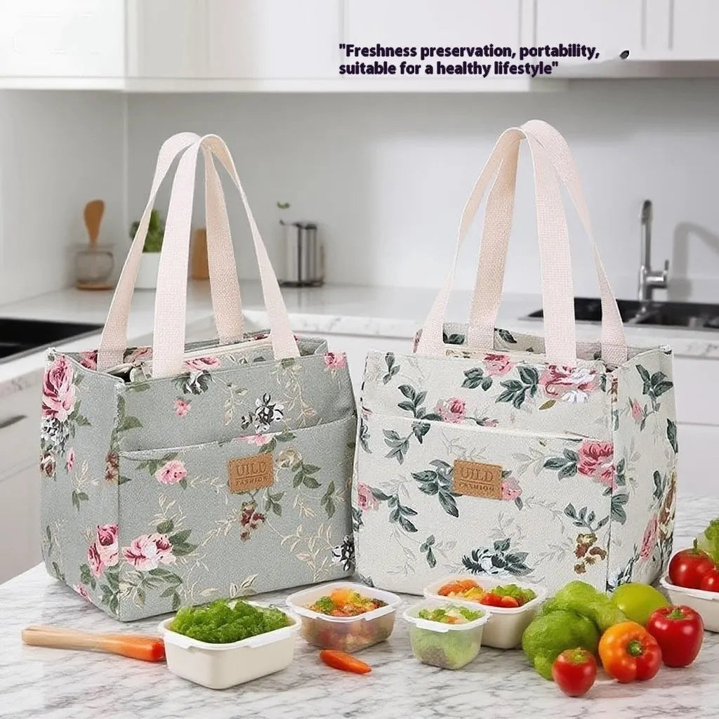 Women's printed canvas tote bag with aluminium handles in a floral or cat design.