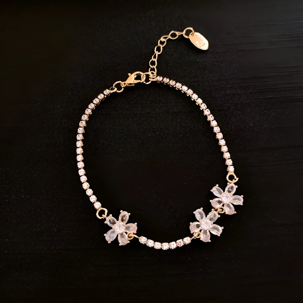 Gold geometric copper bracelet with zircon inlaid detailing and quadrilateral design elements