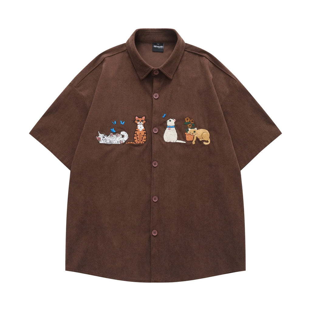 Loose shirt cardigan with embroidered cartoon pattern in apricot, brown, and black colours