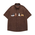 Loose shirt cardigan with embroidered cartoon pattern in apricot, brown, and black colours
